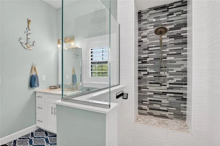 Full bathroom featuring vanity and walk in shower