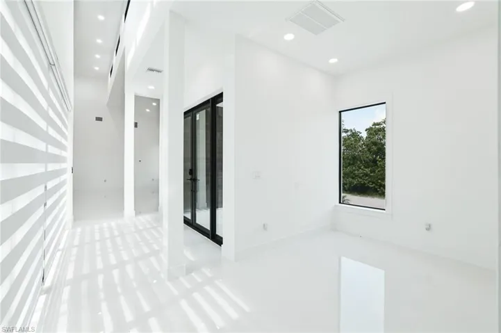 Empty room featuring recessed lighting