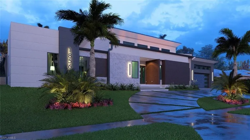 Modern home with a garage, concrete driveway, and a front yard