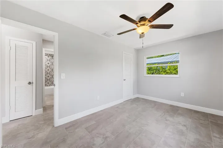 This Guest Bedroom has multiple windows, is quite larger and is just off the Guest bath.