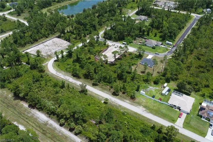 Aerial view of property's location featuring a large body of water