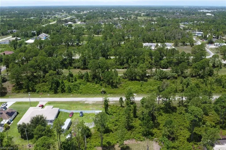 View of property location featuring a heavily wooded area