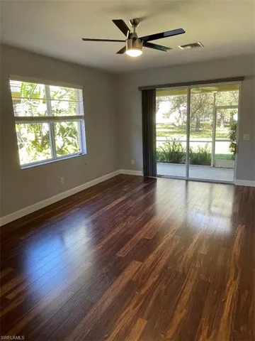 view of lanai, ceiling fan, and a healthy amount of sunlight