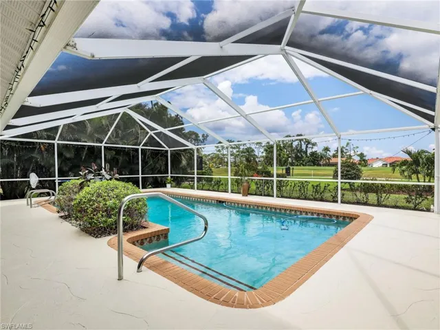 View of swimming pool and screen enclosure