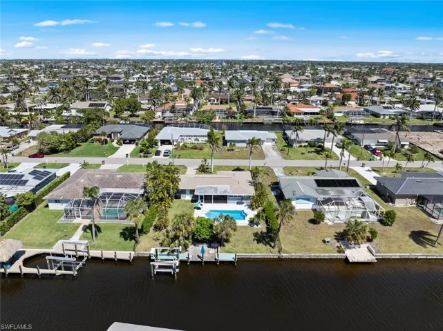 Aerial view with a residential view and a water view