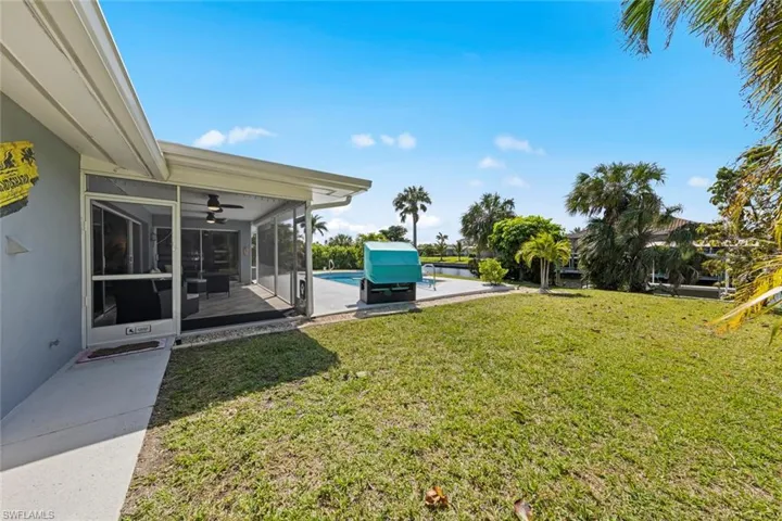 View of yard with a sunroom and a patio