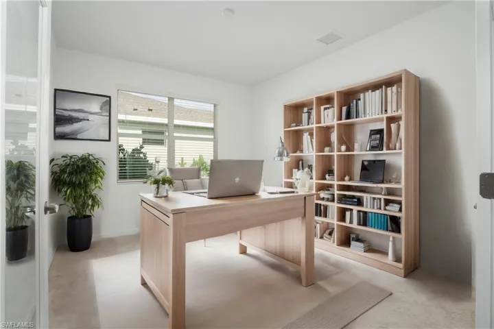 Home office OR den area with glass french doors.