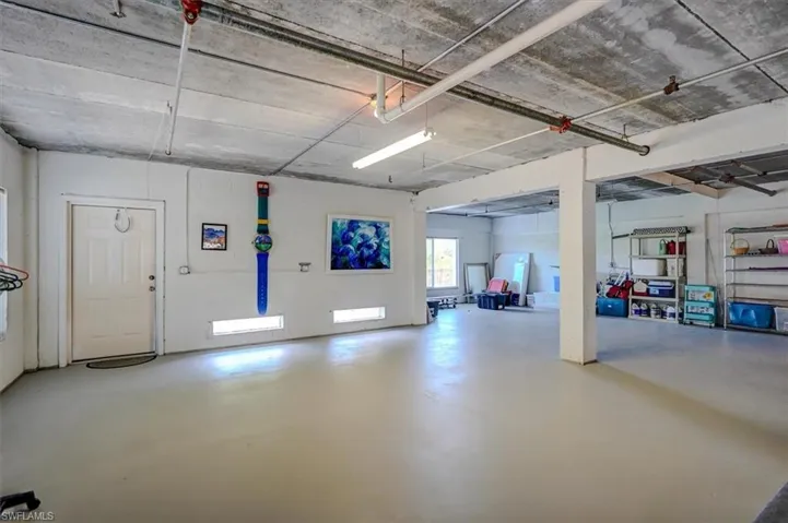 Partial view of HUGE 6 car garage w/ access to 2nd lanai