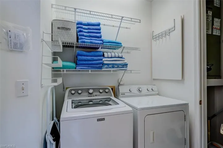 Laundry room featuring washer and dryer and laundry area