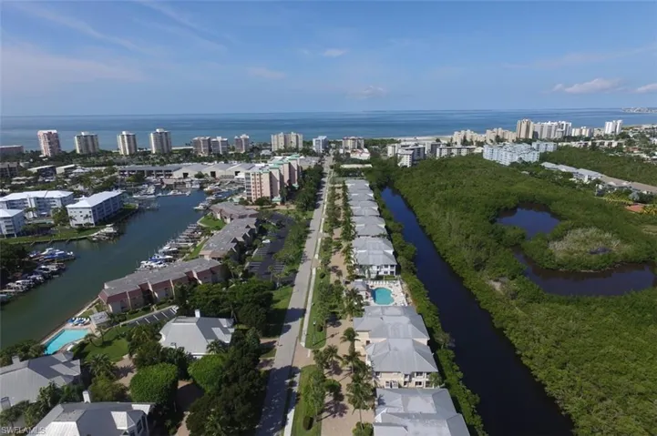 Birds eye view of property with a city view , preserve and of Gulf  of Mexico
