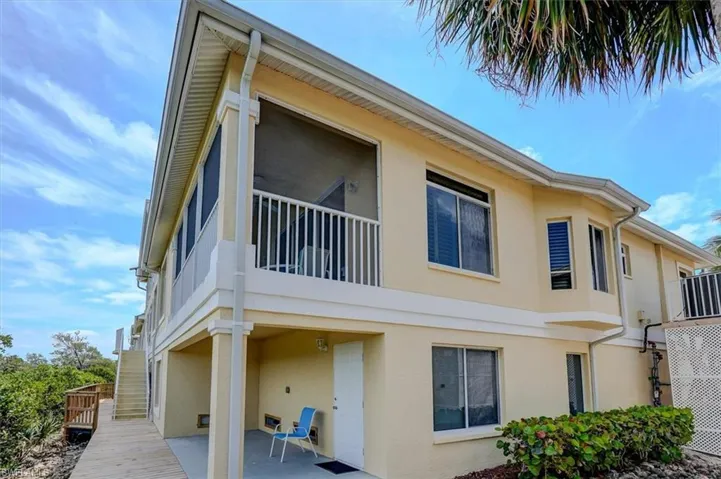 View of side of home with second lanai / patio and boardwalk