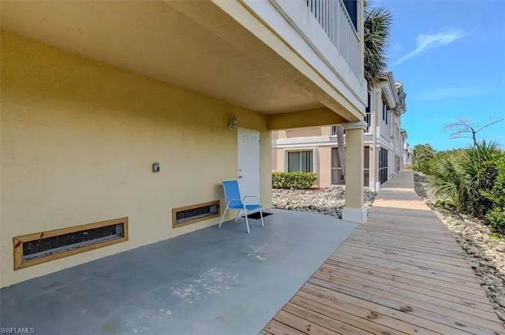 View of patio (2nd lanai) and boardwalk towards pool area
