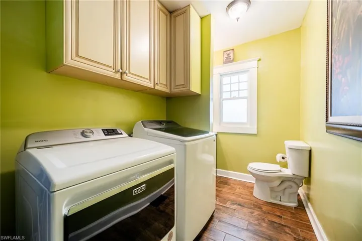 Lower Level Laundry with half bath off kitchen