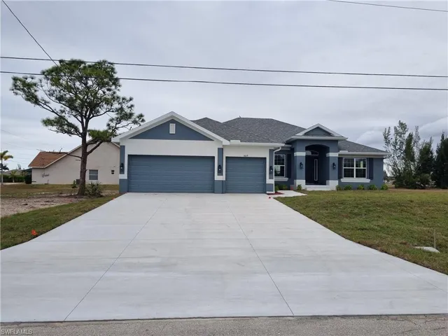 View of front facade with stucco siding, a front yard, driveway, roof with shingles, and an attached garage