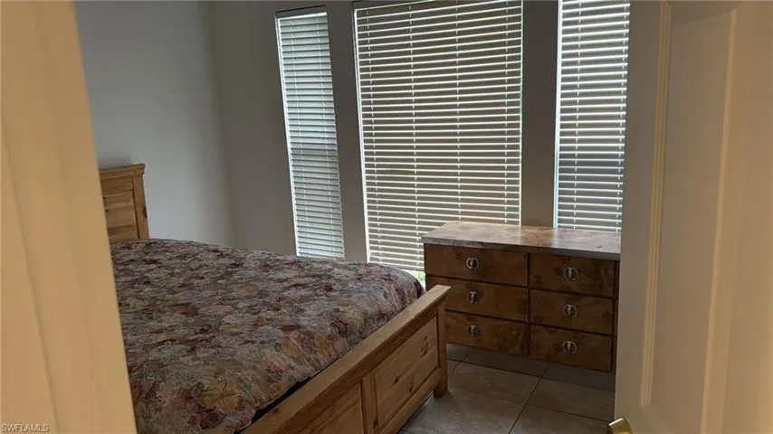 Bedroom featuring light tile patterned floors