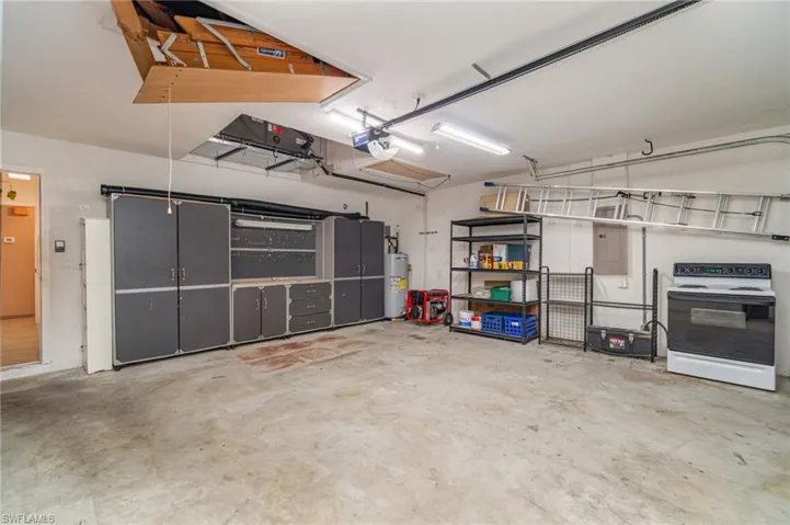 Garage with water heater and a garage door opener