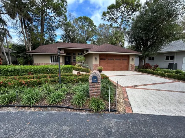 Ranch-style home with stucco siding, decorative driveway, a garage, and a shingled roof