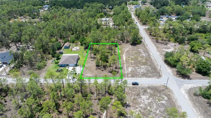 Aerial overview of property's location with property parcel outlined