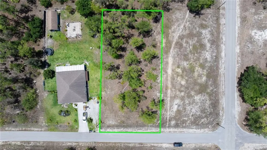 Aerial view of property's location featuring property parcel outlined