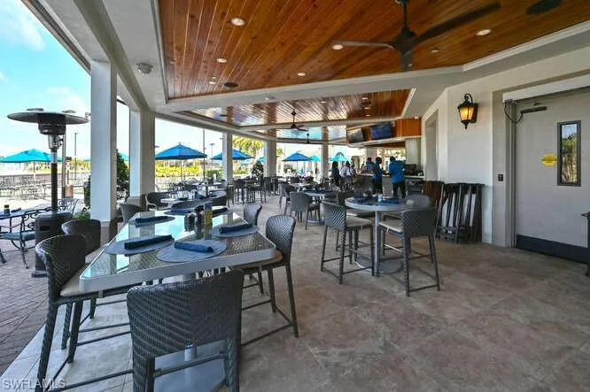 Dining space featuring ceiling fan and wooden ceiling