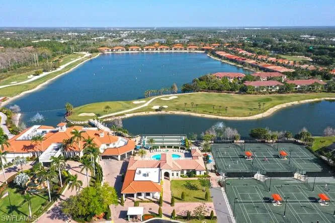 Bird's eye view with golf course view and a water view