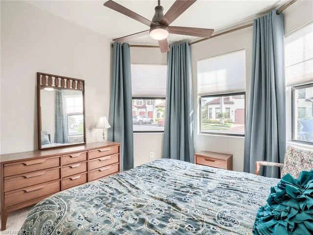 Bedroom with carpet and ceiling fan