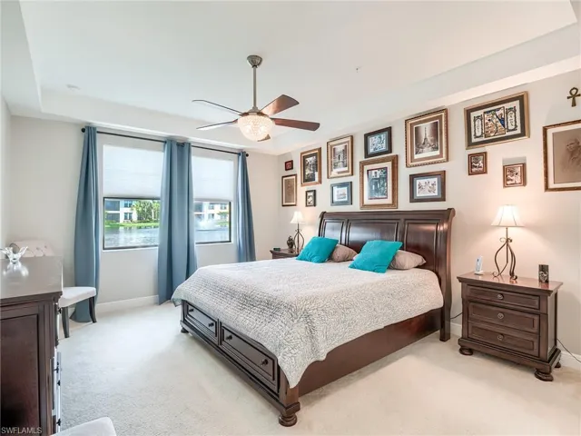 Bedroom featuring ceiling fan and light carpet