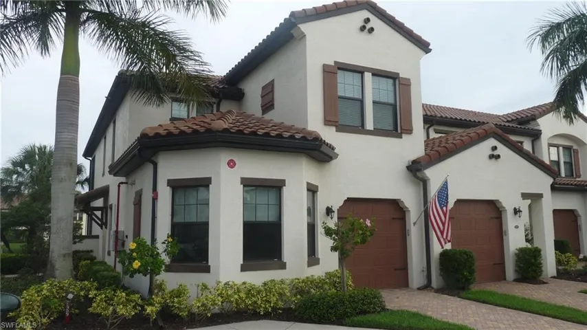 Mediterranean / spanish home featuring a garage