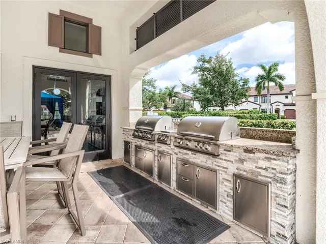 View of patio featuring a grill and an outdoor kitchen