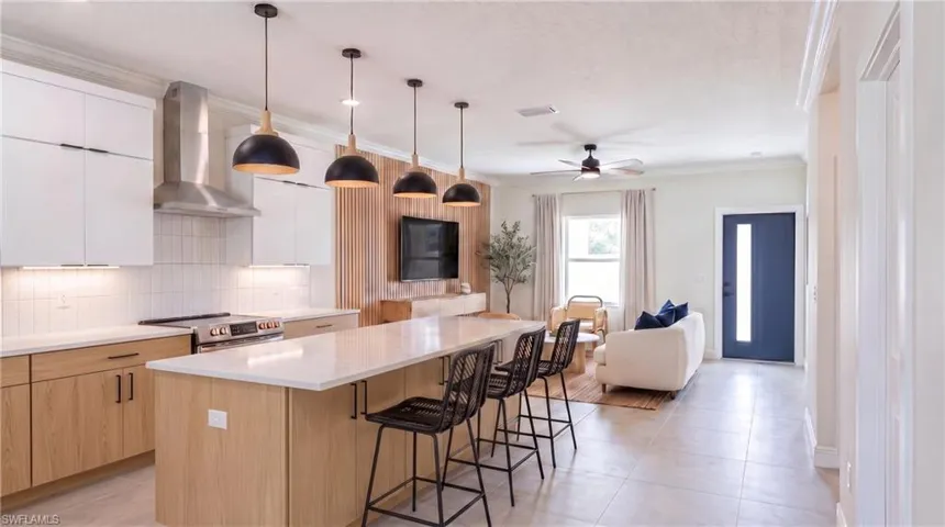 Kitchen looking toward the living room. Digital rendering, virtually staged.