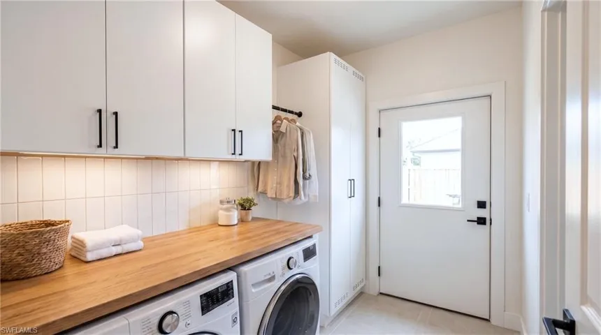 Laundry room. Digital rendering, virtually staged.