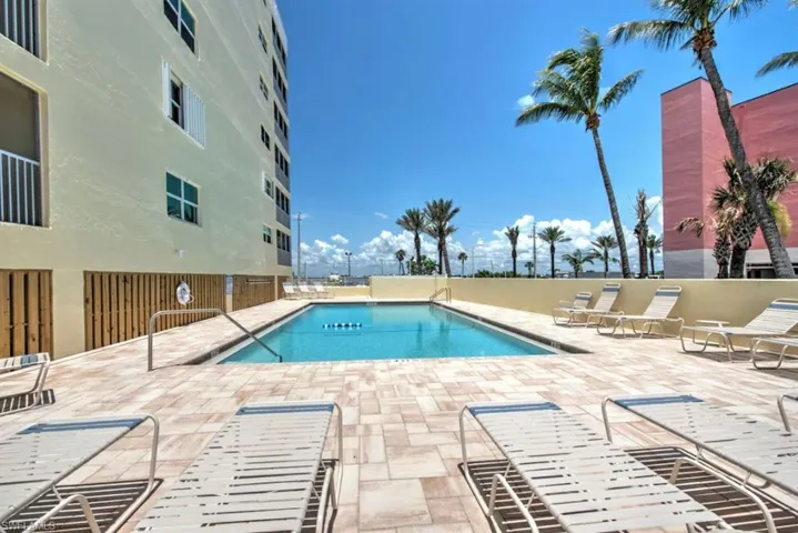Community pool with a patio area
