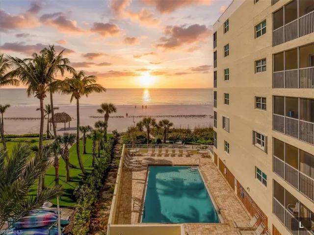 Community pool with view of Gulf and beach