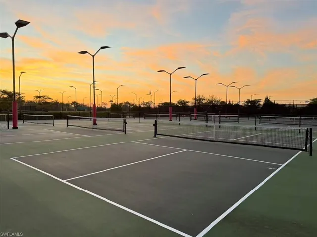 View of tennis court featuring community basketball court