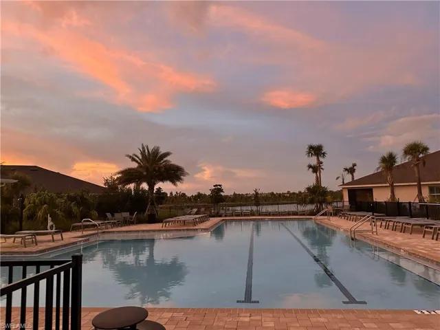 Community pool featuring a patio