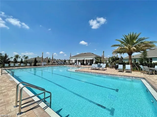 Community pool with a patio area