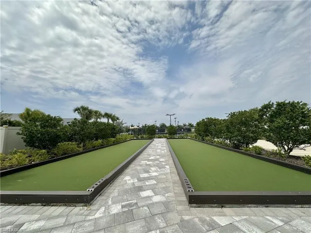 View of property's community with a bocce ball area