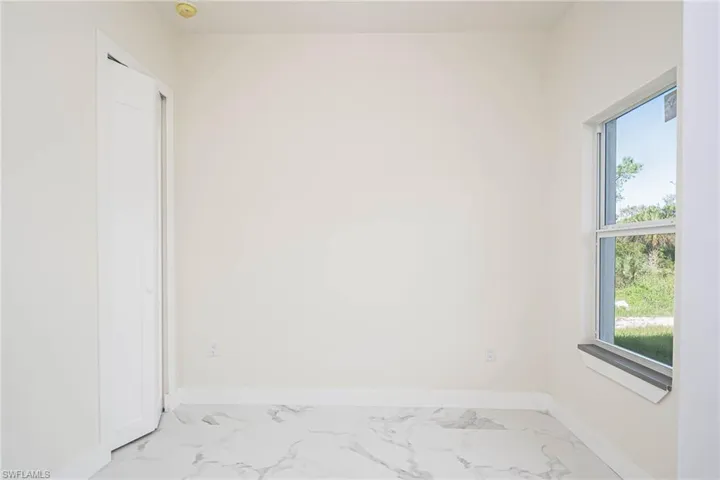 Empty room featuring a healthy amount of sunlight