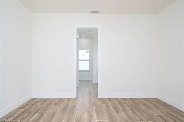 Empty room featuring light hardwood / wood-style flooring