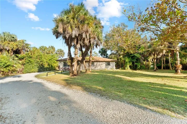 Ranch-style home with a front lawn