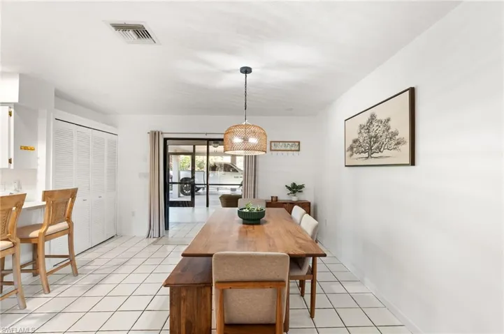 Dining area featuring light tile