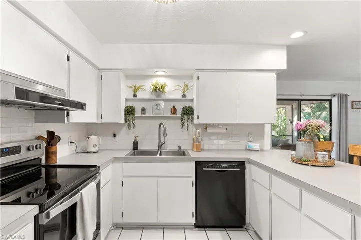 Kitchen featuring stainless steel electric range