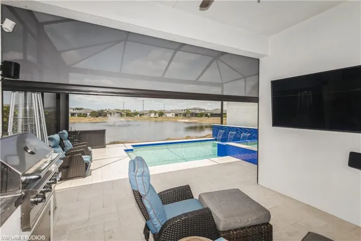 Swimming pool with grilling area and a patio area