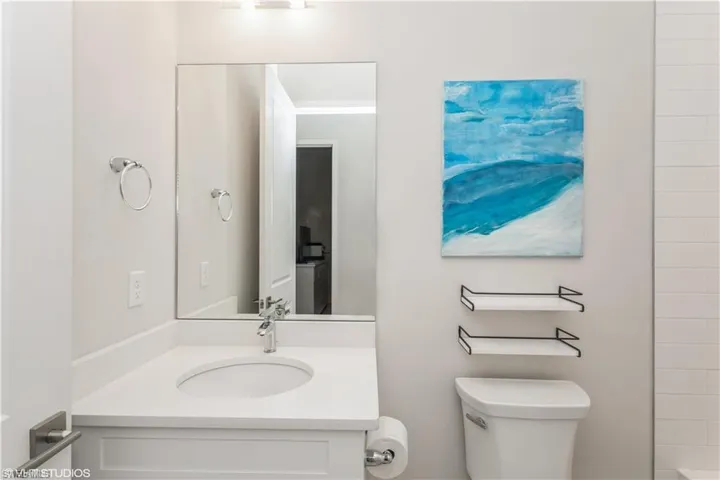 Full bath featuring toilet and vanity