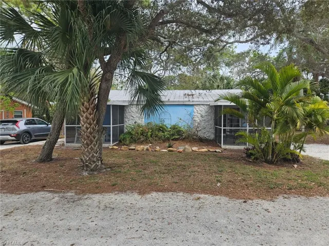 View of front facade featuring a sunroom