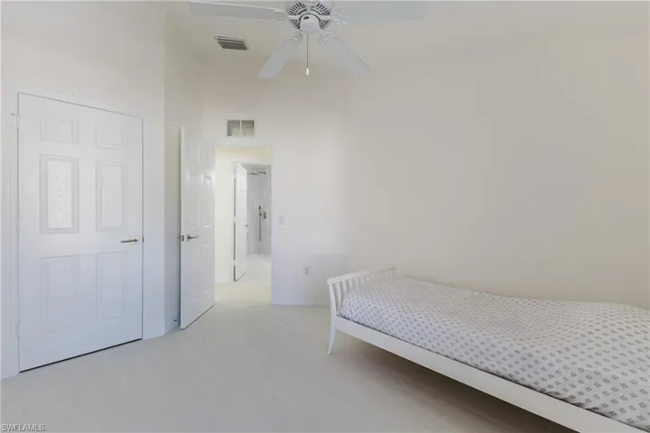 Bedroom featuring baseboards and ceiling fan