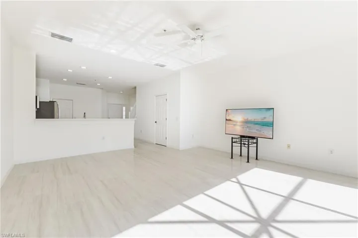 Unfurnished living room with a ceiling fan, light wood-style floors, and recessed lighting