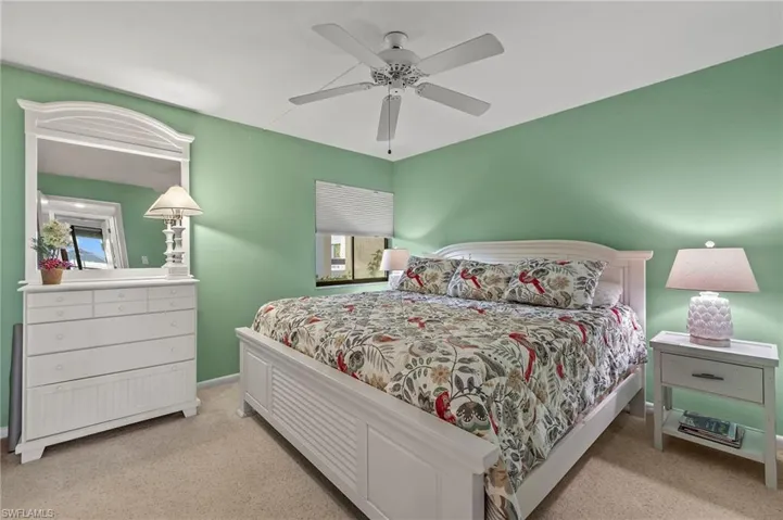 Bedroom featuring ceiling fan and light carpet