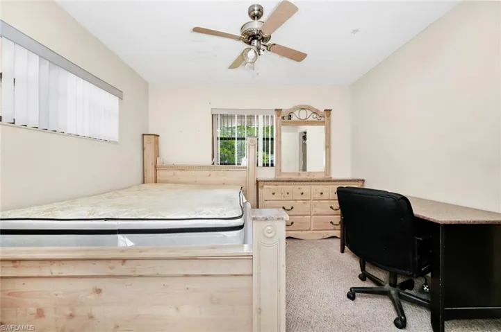 Bedroom featuring ceiling fan and light colored carpet