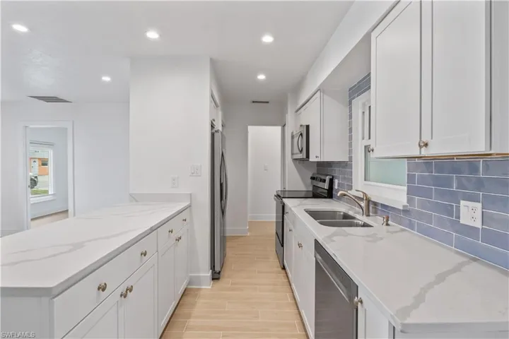 Completely remodeled kitchen with sleek finishes and a functional layout.